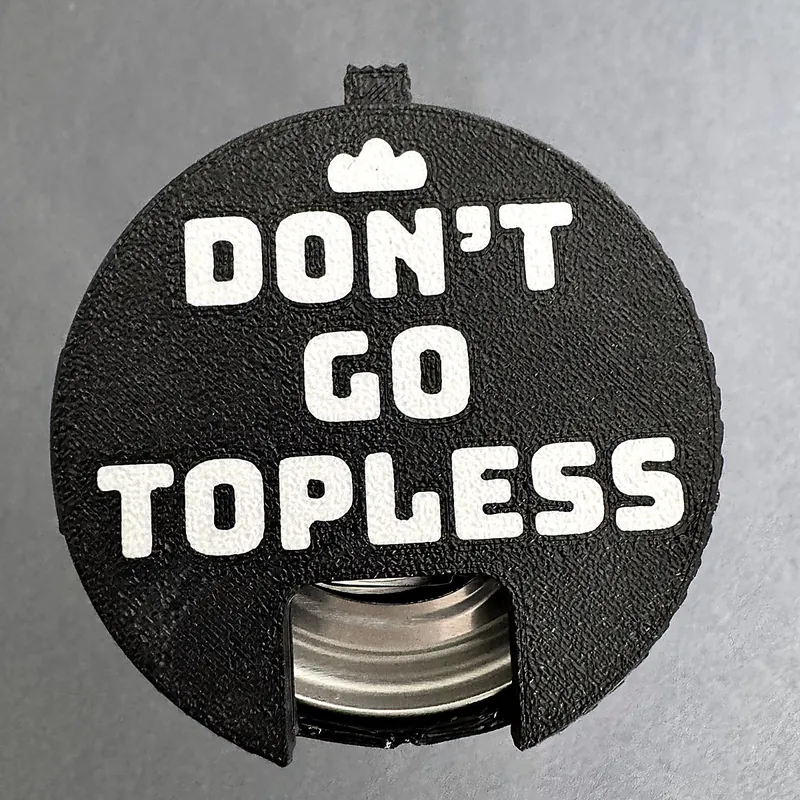 A black Don't go topless Top Block on a can, twisted open to sip