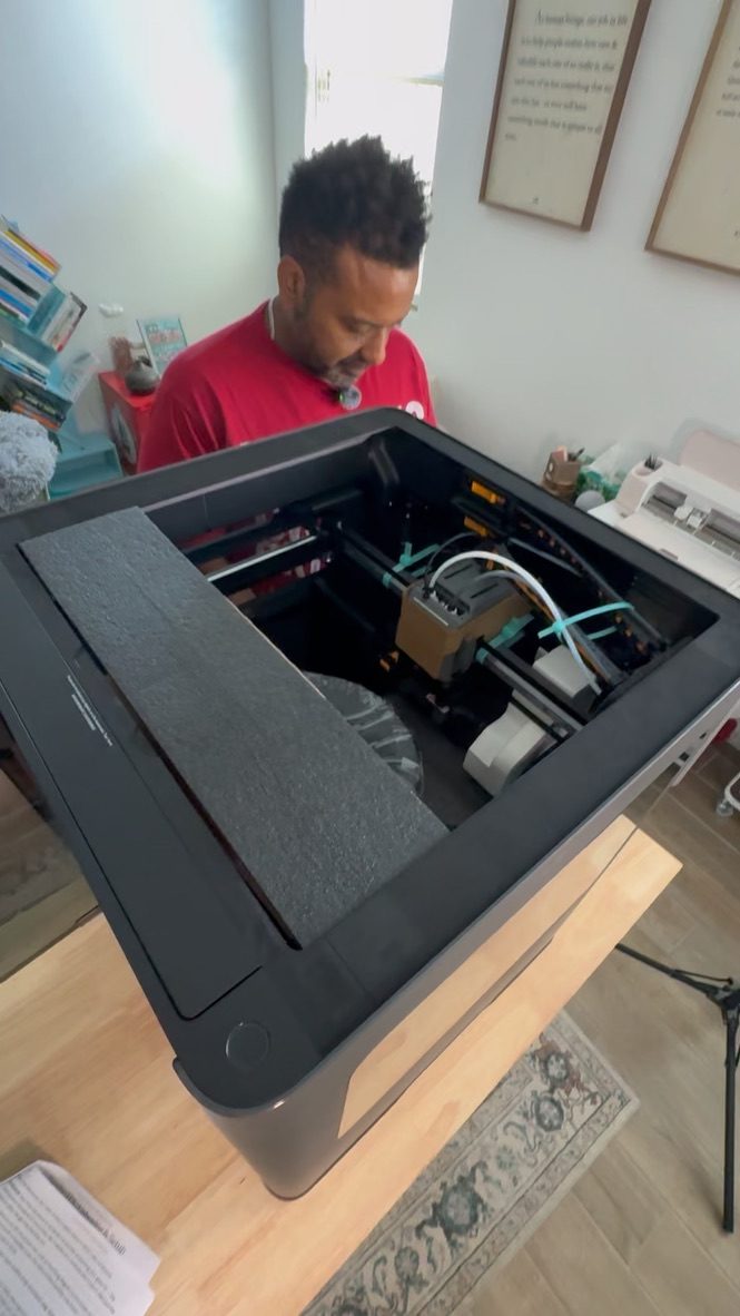 Inside the new printer during setup, with the shipping foam and hardware still in place